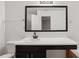 Bathroom has a vanity, decorative framed mirror, and a bathtub at 1823 Devon Dr # 1823, Atlanta, GA 30311