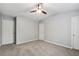 Bedroom features neutral walls, plush carpet, and multiple doorways at 1823 Devon Dr # 1823, Atlanta, GA 30311