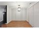 Dining area with modern lighting, neutral walls, and hardwood floors at 1823 Devon Dr # 1823, Atlanta, GA 30311