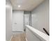 Second floor hallway features carpet floors, white doors, and stairway access at 1823 Devon Dr # 1823, Atlanta, GA 30311