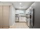 Modern kitchen with stainless steel appliances, ample counter space, and white cabinetry at 1823 Devon Dr # 1823, Atlanta, GA 30311