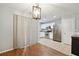 Eat-in kitchen with stainless steel appliances, white cabinets, and a view of the dining area at 1823 Devon Dr # 1823, Atlanta, GA 30311
