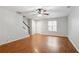 Spacious living room with hardwood floors, staircase, and ample natural light at 1823 Devon Dr # 1823, Atlanta, GA 30311