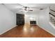 Bright living room with hardwood floors, a fireplace, and a staircase to the upper level at 1823 Devon Dr # 1823, Atlanta, GA 30311
