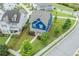 Aerial view of a well-manicured property featuring blue siding, stone accents, and lush landscaping at 1946 Jeffery Nw Rd, Atlanta, GA 30318