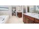 Luxurious bathroom with double vanities, a soaking tub, and elegant tile work at 1946 Jeffery Nw Rd, Atlanta, GA 30318
