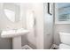 Clean half-bath features pedestal sink, white fixtures, and ample space at 1946 Jeffery Nw Rd, Atlanta, GA 30318