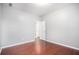 Neutral bedroom featuring hardwood flooring and a doorway leading to another room at 1946 Jeffery Nw Rd, Atlanta, GA 30318