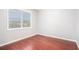 Empty bedroom with hardwood flooring, a window, and neutral paint at 1946 Jeffery Nw Rd, Atlanta, GA 30318