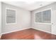 Cozy bedroom with hardwood flooring and two large windows at 1946 Jeffery Nw Rd, Atlanta, GA 30318