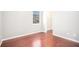 Well-lit bedroom with hardwood floors, and a doorway leading to a walk-in closet at 1946 Jeffery Nw Rd, Atlanta, GA 30318