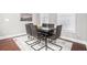 Elegant dining room features modern table set and large window for natural light at 1946 Jeffery Nw Rd, Atlanta, GA 30318