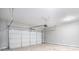 Spacious two-car garage with white door, concrete floor, overhead lighting, and chain operated door at 1946 Jeffery Nw Rd, Atlanta, GA 30318