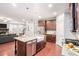 Open concept kitchen with an island and stainless steel appliances flows into living area at 1946 Jeffery Nw Rd, Atlanta, GA 30318