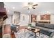 Inviting living room featuring a stone fireplace, hardwood floors, and an open layout to the kitchen at 1946 Jeffery Nw Rd, Atlanta, GA 30318