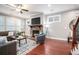 Comfortable living room featuring a stone fireplace, ample seating, and stylish decor at 1946 Jeffery Nw Rd, Atlanta, GA 30318