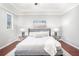 Spacious bedroom featuring hardwood floors, tray ceilings, and abundant natural light at 1946 Jeffery Nw Rd, Atlanta, GA 30318