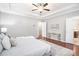 Large primary suite features tray ceilings and an open doorway to ensuite bathroom at 1946 Jeffery Nw Rd, Atlanta, GA 30318