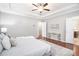 Relaxing main bedroom with hardwood floors, tray ceilings, and an ensuite bathroom at 1946 Jeffery Nw Rd, Atlanta, GA 30318