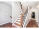 Staircase with wood steps and black wrought iron balusters at 1946 Jeffery Nw Rd, Atlanta, GA 30318