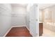 Spacious walk-in closet with hardwood flooring and wire shelving system at 1946 Jeffery Nw Rd, Atlanta, GA 30318