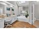 Bright bathroom with a large vanity, soaking tub, and ample natural light from a skylight at 361 Sarah Ln, Lawrenceville, GA 30046