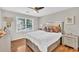 Well-lit bedroom with hardwood floors, a large window and neutral decor at 361 Sarah Ln, Lawrenceville, GA 30046