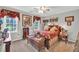 Bedroom features a ceiling fan, closet and two large windows for natural light at 361 Sarah Ln, Lawrenceville, GA 30046