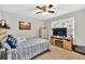 Cozy bedroom featuring carpet, ceiling fan and a window for natural light at 361 Sarah Ln, Lawrenceville, GA 30046