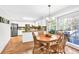 Open dining and kitchen area with hardwood floors and a view of the backyard at 361 Sarah Ln, Lawrenceville, GA 30046