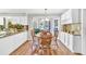 Charming dining area with wood table, chairs, and lots of natural light from bay windows at 361 Sarah Ln, Lawrenceville, GA 30046