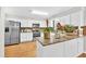 Bright kitchen with stainless steel appliances, granite countertops, and white cabinets at 361 Sarah Ln, Lawrenceville, GA 30046