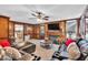 Spacious living room with fireplace, television, and comfortable seating and view to dining area at 361 Sarah Ln, Lawrenceville, GA 30046