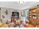 Comfortable living room featuring neutral walls, hardwood floors and natural light at 361 Sarah Ln, Lawrenceville, GA 30046