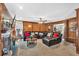 Well-lit living room features a fireplace, mounted television, and comfortable leather seating at 361 Sarah Ln, Lawrenceville, GA 30046