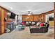 Spacious living room with wood paneling, fireplace, and plush leather sectional at 361 Sarah Ln, Lawrenceville, GA 30046