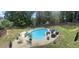 Backyard features a private kidney-shaped pool and patio area with seating for outdoor enjoyment at 361 Sarah Ln, Lawrenceville, GA 30046