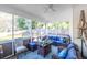 Enclosed porch offering outdoor comfort, featuring wicker seating, a ceiling fan, and view of backyard at 361 Sarah Ln, Lawrenceville, GA 30046