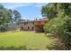 Expansive backyard featuring a large deck, perfect for outdoor gatherings and relaxation at 530 Village Green Sw Ct, Lilburn, GA 30047
