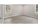 Bright bedroom with ample natural light and contemporary flooring at 530 Village Green Sw Ct, Lilburn, GA 30047