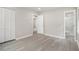 Spacious bedroom with gray flooring, closet, and ensuite bathroom featuring tiled shower at 530 Village Green Sw Ct, Lilburn, GA 30047
