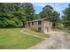 Spacious home featuring a two-car garage and a long, paved driveway at 530 Village Green Sw Ct, Lilburn, GA 30047