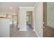 Inviting entry into the home's open-concept living space and updated flooring at 530 Village Green Sw Ct, Lilburn, GA 30047