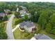Aerial view showcases home with a pool, clubhouse, and wooded surroundings at 1235 Grand View Se Dr, Smyrna, GA 30126
