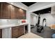 Basement wet bar with shaker cabinets, wine fridge, beverage cooler, quartz countertop and access to the home gym at 1235 Grand View Se Dr, Smyrna, GA 30126