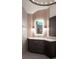 Modern bathroom vanity with beautiful wall sconces and a stylish mirror at 1235 Grand View Se Dr, Smyrna, GA 30126