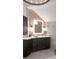 Modern bathroom vanity with beautiful wall sconces and a stylish mirror at 1235 Grand View Se Dr, Smyrna, GA 30126