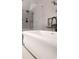 Modern bathroom with a freestanding tub, complemented by stylish fixtures, lighting, and decor at 1235 Grand View Se Dr, Smyrna, GA 30126