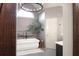Modern bathroom with a freestanding tub, complemented by stylish fixtures, lighting, and decor at 1235 Grand View Se Dr, Smyrna, GA 30126