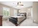 Cozy bedroom features neutral colors and a door leading to a tiled bathroom at 1235 Grand View Se Dr, Smyrna, GA 30126
